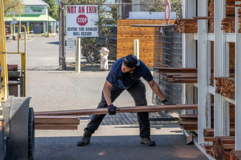 Mead Clark lumberyard working stocking lumber